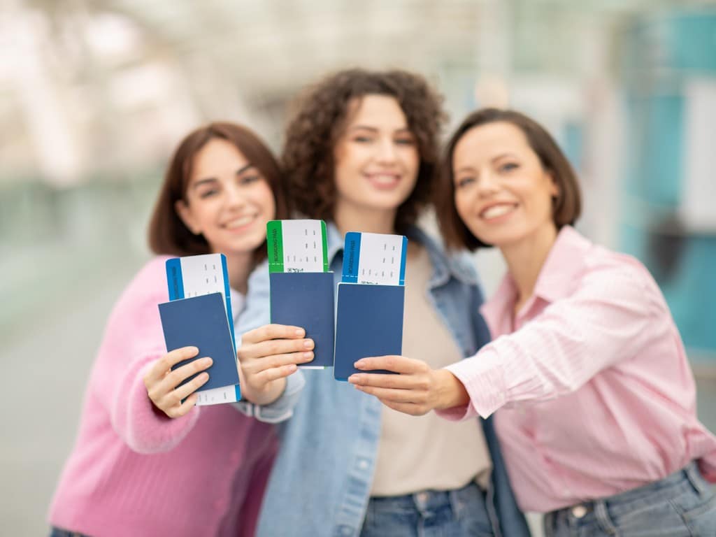 Buy condo in Pattaya three friends joyfully displaying their passports 2024 10 22 01 21 29 utc